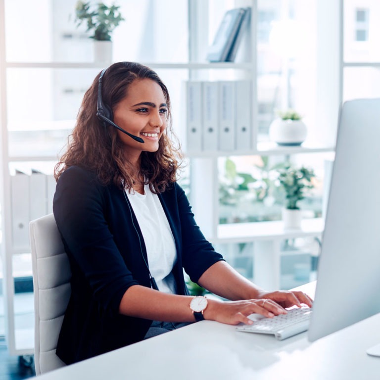 Hub Group team member offering new levels of logistics management solutions in office